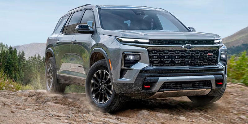 A 2025 Chevrolet Traverse navigating a rocky trail, showcasing its off-road capabilities.