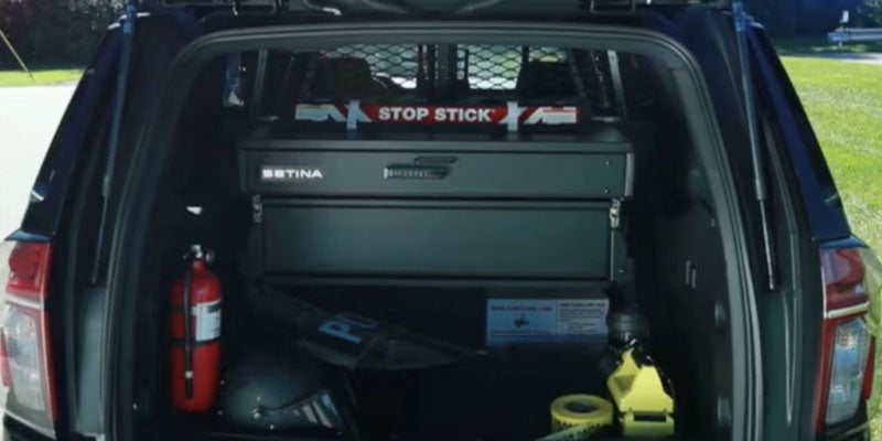 2025 Chevrolet Police vehicle open trunk displaying cargo space
